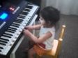 Isabella playing Alphabet song on the piano.MP4